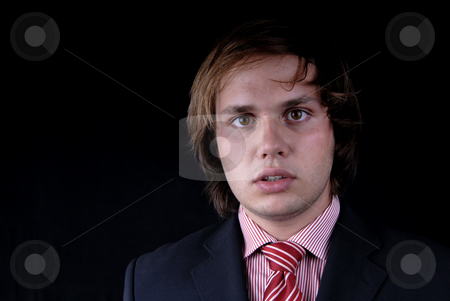 To use this stock image in your creative project, please select the size you need over to the right and click the "Add to Cart" button.
Your downloaded image will come with the Cutcaster watermark removed so don’t worry about the watermark you see on this page. Portrait stock photo, Young business man portrait on black background by Rui Vale de Sousa