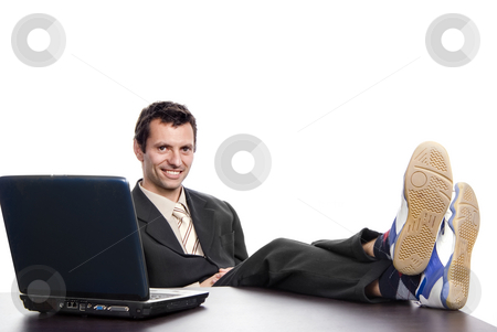 To use this stock image in your creative project, please select the size you need over to the right and click the "Add to Cart" button.
Your downloaded image will come with the Cutcaster watermark removed so don’t worry about the watermark you see on this page. Working stock photo, Young man working with his personal computer by Rui Vale de Sousa