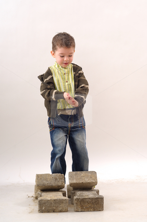 To use this stock image in your creative project, please select the size you need over to the right and click the "Add to Cart" button.
Your downloaded image will come with the Cutcaster watermark removed so don’t worry about the watermark you see on this page. Small boy in construction stock photo, Small boy working in construction by Dragos Iliescu