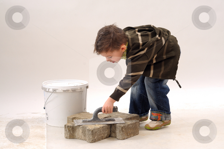 To use this stock image in your creative project, please select the size you need over to the right and click the "Add to Cart" button.
Your downloaded image will come with the Cutcaster watermark removed so don’t worry about the watermark you see on this page. Small boy in construction stock photo, Small boy working in construction by Dragos Iliescu