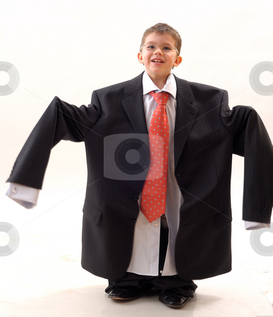 To use this stock image in your creative project, please select the size you need over to the right and click the "Add to Cart" button.
Your downloaded image will come with the Cutcaster watermark removed so don’t worry about the watermark you see on this page. Elegant, small businessman stock photo, Elegant small businessman with glass and modern tie by Dragos Iliescu