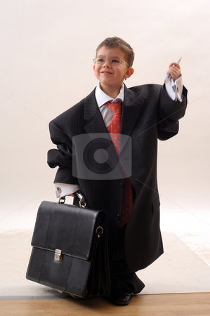 To use this stock image in your creative project, please select the size you need over to the right and click the "Add to Cart" button.
Your downloaded image will come with the Cutcaster watermark removed so don’t worry about the watermark you see on this page. Elegant, small businessman stock photo, Elegant small businessman with glass and modern tie by Dragos Iliescu