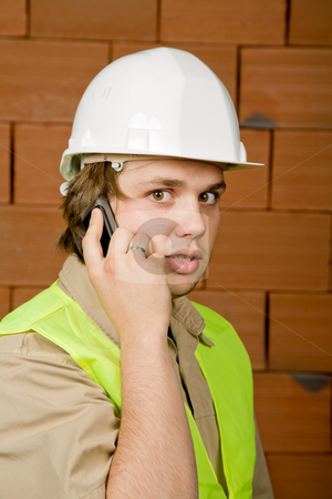 To use this stock image in your creative project, please select the size you need over to the right and click the "Add to Cart" button.
Your downloaded image will come with the Cutcaster watermark removed so don’t worry about the watermark you see on this page. Calling stock photo, Engineer with white hat with a brick wall as background by Rui Vale de Sousa