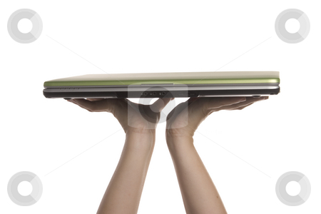 To use this stock image in your creative project, please select the size you need over to the right and click the "Add to Cart" button.
Your downloaded image will come with the Cutcaster watermark removed so don’t worry about the watermark you see on this page. A womans hands holding a laptop stock photo, A womans hands are holding a laptop high overhead by Matt Baker