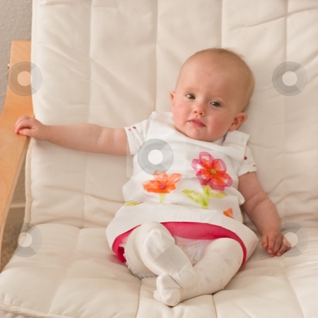 To use this stock image in your creative project, please select the size you need over to the right and click the "Add to Cart" button.
Your downloaded image will come with the Cutcaster watermark removed so don’t worry about the watermark you see on this page. Little baby girl stock photo, Cute caucasian little baby girl sitting o a chair. by Mariusz Jurgielewicz
