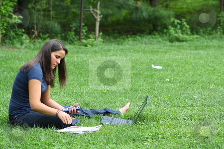 To use this stock image in your creative project, please select the size you need over to the right and click the "Add to Cart" button.
Your downloaded image will come with the Cutcaster watermark removed so don’t worry about the watermark you see on this page. College student studying outdoors stock photo, Girl studying outside at a park. by Chris Torres