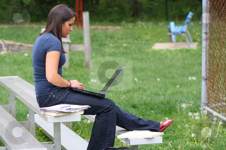 To use this stock image in your creative project, please select the size you need over to the right and click the "Add to Cart" button.
Your downloaded image will come with the Cutcaster watermark removed so don’t worry about the watermark you see on this page. College student studying outdoors stock photo, Girl studying outside at a park. by Chris Torres