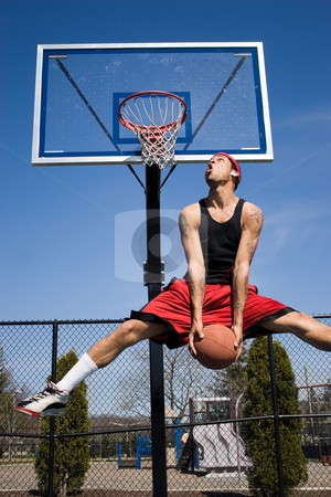 To use this stock image in your creative project, please select the size you need over to the right and click the "Add to Cart" button.
Your downloaded image will come with the Cutcaster watermark removed so don’t worry about the watermark you see on this page. Man Dunking a Basketball stock photo, A young basketball player driving to the hoop. by Todd Arena