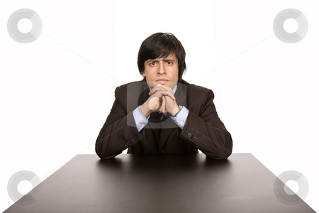 To use this stock image in your creative project, please select the size you need over to the right and click the "Add to Cart" button.
Your downloaded image will come with the Cutcaster watermark removed so don’t worry about the watermark you see on this page. Thinking stock photo, Young business man on a desk, isolated on white by Rui Vale de Sousa