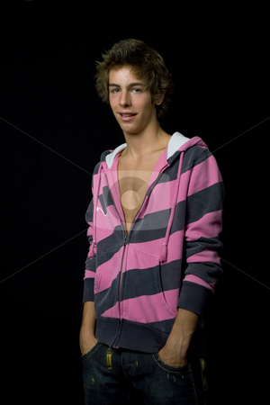 To use this stock image in your creative project, please select the size you need over to the right and click the "Add to Cart" button.
Your downloaded image will come with the Cutcaster watermark removed so don’t worry about the watermark you see on this page. Young boy with shirt stock photo, Young casual man against a black background by Rui Vale de Sousa