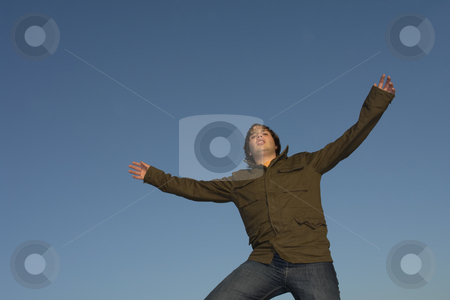 To use this stock image in your creative project, please select the size you need over to the right and click the "Add to Cart" button.
Your downloaded image will come with the Cutcaster watermark removed so don’t worry about the watermark you see on this page. Free stock photo, Young man with arms wide open and the sky by Rui Vale de Sousa