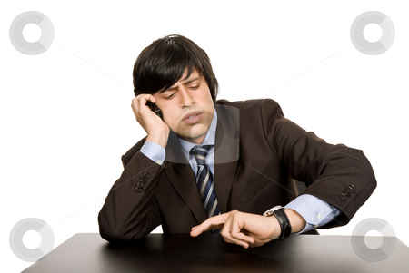 To use this stock image in your creative project, please select the size you need over to the right and click the "Add to Cart" button.
Your downloaded image will come with the Cutcaster watermark removed so don’t worry about the watermark you see on this page. Working stock photo, Young business man on a desk, isolated on white by Rui Vale de Sousa