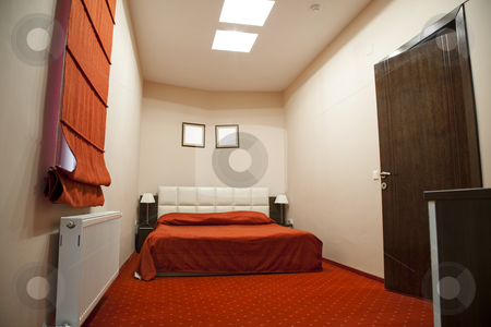 To use this stock image in your creative project, please select the size you need over to the right and click the "Add to Cart" button.
Your downloaded image will come with the Cutcaster watermark removed so don’t worry about the watermark you see on this page. Hotel room stock photo, Hotel room with red and beige four stars empty by Adrian Costea