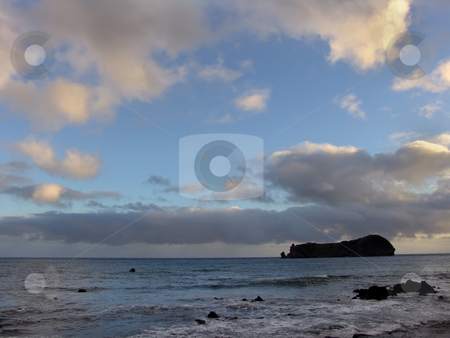 To use this stock image in your creative project, please select the size you need over to the right and click the "Add to Cart" button.
Your downloaded image will come with the Cutcaster watermark removed so don’t worry about the watermark you see on this page. Island stock photo, Small island in azores by Rui Vale de Sousa
