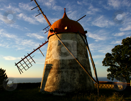 To use this stock image in your creative project, please select the size you need over to the right and click the "Add to Cart" button.
Your downloaded image will come with the Cutcaster watermark removed so don’t worry about the watermark you see on this page. Windmill stock photo, Azores ancient windmill by Rui Vale de Sousa