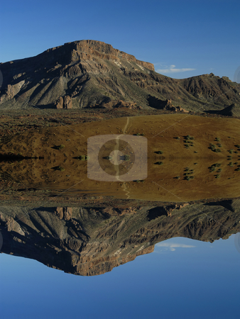 To use this stock image in your creative project, please select the size you need over to the right and click the "Add to Cart" button.
Your downloaded image will come with the Cutcaster watermark removed so don’t worry about the watermark you see on this page. Mountains stock photo, Arid african mountain landscape with digital water reflection by Rui Vale de Sousa