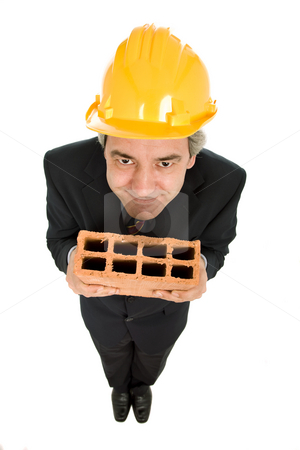 To use this stock image in your creative project, please select the size you need over to the right and click the "Add to Cart" button.
Your downloaded image will come with the Cutcaster watermark removed so don’t worry about the watermark you see on this page. Holding a brick stock photo, Mature worker holding a brick, isolated on white by Rui Vale de Sousa
