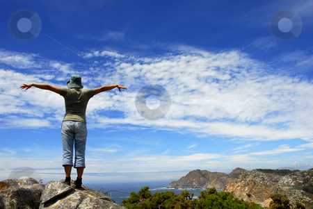 To use this stock image in your creative project, please select the size you need over to the right and click the "Add to Cart" button.
Your downloaded image will come with the Cutcaster watermark removed so don’t worry about the watermark you see on this page. Happy stock photo, Happy woman with arms wide open at the coast by Rui Vale de Sousa