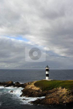 To use this stock image in your creative project, please select the size you need over to the right and click the "Add to Cart" button.
Your downloaded image will come with the Cutcaster watermark removed so don’t worry about the watermark you see on this page. Lighthouse stock photo, Small lighthouse at the coast of north of spain by Rui Vale de Sousa