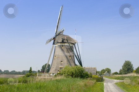 To use this stock image in your creative project, please select the size you need over to the right and click the "Add to Cart" button.
Your downloaded image will come with the Cutcaster watermark removed so don’t worry about the watermark you see on this page. Archetypal Dutch Windmill stock photo, An archetypal Dutch windmill in Leidschendam on a nice spring day. by Corepics VOF