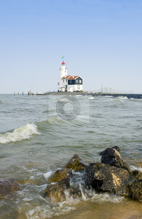 To use this stock image in your creative project, please select the size you need over to the right and click the "Add to Cart" button.
Your downloaded image will come with the Cutcaster watermark removed so don’t worry about the watermark you see on this page. Dutch Lighthouse stock photo, The famous lighthouse at Marken, aptly called