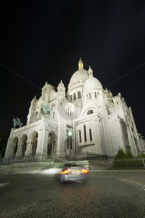 To use this stock image in your creative project, please select the size you need over to the right and click the "Add to Cart" button.
Your downloaded image will come with the Cutcaster watermark removed so don’t worry about the watermark you see on this page. Sacr? Coeur at Night stock photo, A car turning in front of the Sacr? Coeur at night, using a wide angle perspective. The illumination of the church makes it stand out beautifully against the dark sky. by Corepics VOF