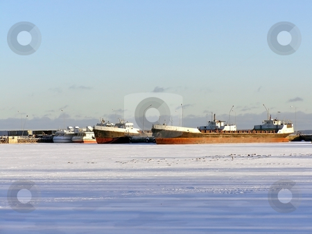 To use this stock image in your creative project, please select the size you need over to the right and click the "Add to Cart" button.
Your downloaded image will come with the Cutcaster watermark removed so don’t worry about the watermark you see on this page. Ships on the ice stock photo, Many ships in ice of the frozen winter sea by Sergej Razvodovskij