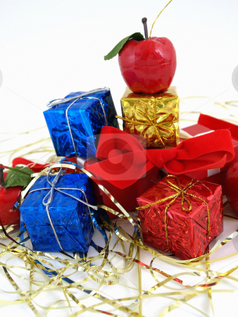 To use this stock image in your creative project, please select the size you need over to the right and click the "Add to Cart" button.
Your downloaded image will come with the Cutcaster watermark removed so don’t worry about the watermark you see on this page. Christmas Packages stock photo, Colorful gift boxes and tinsel studio isolated against a white background. by Robert Gebbie