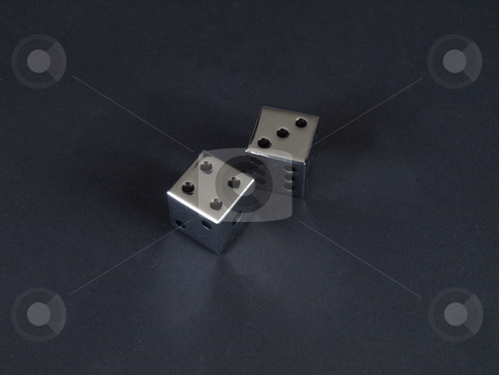 To use this stock image in your creative project, please select the size you need over to the right and click the "Add to Cart" button.
Your downloaded image will come with the Cutcaster watermark removed so don’t worry about the watermark you see on this page. Seven Craps stock photo, Two metal dice showing a score of seven on a black background. by Robert Gebbie