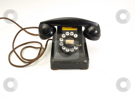 To use this stock image in your creative project, please select the size you need over to the right and click the "Add to Cart" button.
Your downloaded image will come with the Cutcaster watermark removed so don’t worry about the watermark you see on this page. Rotary Dial Telephone stock photo, An antique black rotary dial telephone isolated against a white background. by Robert Gebbie