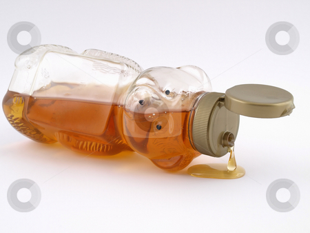 To use this stock image in your creative project, please select the size you need over to the right and click the "Add to Cart" button.
Your downloaded image will come with the Cutcaster watermark removed so don’t worry about the watermark you see on this page. Honey Bear Drip stock photo, A plastic bear shaped container full of honey on it's side, cap open and dripping. by Robert Gebbie