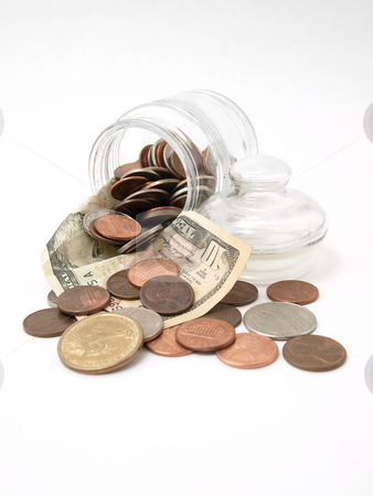 To use this stock image in your creative project, please select the size you need over to the right and click the "Add to Cart" button.
Your downloaded image will come with the Cutcaster watermark removed so don’t worry about the watermark you see on this page. Fun Funds stock photo, A ten dollar bill cradles coins as they spill from a tipped glass jar. by Robert Gebbie