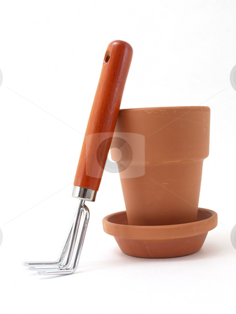 To use this stock image in your creative project, please select the size you need over to the right and click the "Add to Cart" button.
Your downloaded image will come with the Cutcaster watermark removed so don’t worry about the watermark you see on this page. Pot and Rake stock photo, Gardening tool and terra cotta pot and saucer isolated against a white background. by Robert Gebbie