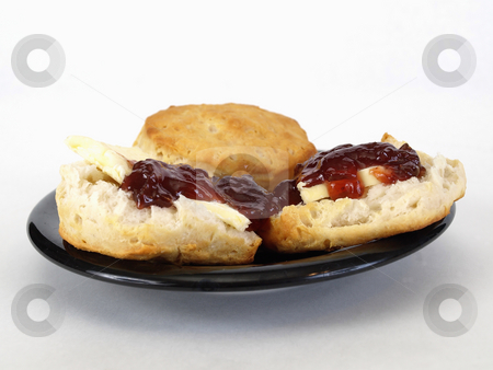 To use this stock image in your creative project, please select the size you need over to the right and click the "Add to Cart" button.
Your downloaded image will come with the Cutcaster watermark removed so don’t worry about the watermark you see on this page. Biscuits and Jelly stock photo, Biscuits with butter and jelly on a black plate over a white background. by Robert Gebbie