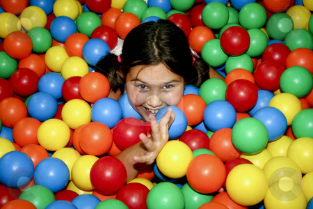 To use this stock image in your creative project, please select the size you need over to the right and click the "Add to Cart" button.
Your downloaded image will come with the Cutcaster watermark removed so don’t worry about the watermark you see on this page. Girl playing stock photo, Gilr covered with clored balls by Jos?