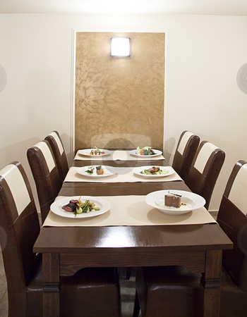 To use this stock image in your creative project, please select the size you need over to the right and click the "Add to Cart" button.
Your downloaded image will come with the Cutcaster watermark removed so don’t worry about the watermark you see on this page. Empty restaurant stock photo, Food plates on the table waiting for customers by Adrian Costea