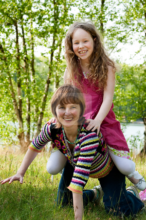 To use this stock image in your creative project, please select the size you need over to the right and click the "Add to Cart" button.
Your downloaded image will come with the Cutcaster watermark removed so don’t worry about the watermark you see on this page. Riding the horse stock photo, Mother and daughter have a happy time together by Frenk and Danielle Kaufmann