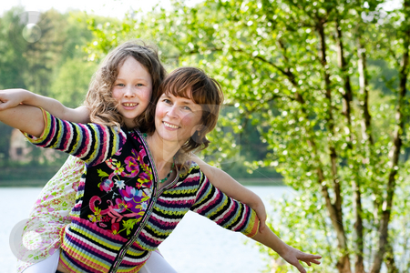 To use this stock image in your creative project, please select the size you need over to the right and click the "Add to Cart" button.
Your downloaded image will come with the Cutcaster watermark removed so don’t worry about the watermark you see on this page. Let's fly stock photo, Mother and daughter have a happy time together by Frenk and Danielle Kaufmann