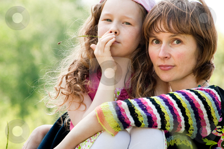 To use this stock image in your creative project, please select the size you need over to the right and click the "Add to Cart" button.
Your downloaded image will come with the Cutcaster watermark removed so don’t worry about the watermark you see on this page. Portrait ot mother and daugther stock photo, Mother and daughter have a happy time together by Frenk and Danielle Kaufmann