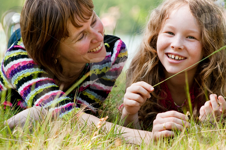 To use this stock image in your creative project, please select the size you need over to the right and click the "Add to Cart" button.
Your downloaded image will come with the Cutcaster watermark removed so don’t worry about the watermark you see on this page. Smiling together stock photo, Mother and daughter have a happy time together by Frenk and Danielle Kaufmann