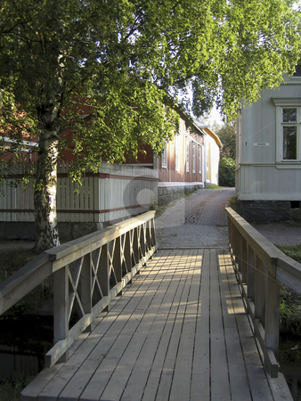 To use this stock image in your creative project, please select the size you need over to the right and click the "Add to Cart" button.
Your downloaded image will come with the Cutcaster watermark removed so don’t worry about the watermark you see on this page. Bridge to the old town stock photo, Wooden bridge to the old town of Rauma, Finland by Alessandro Rizzolli