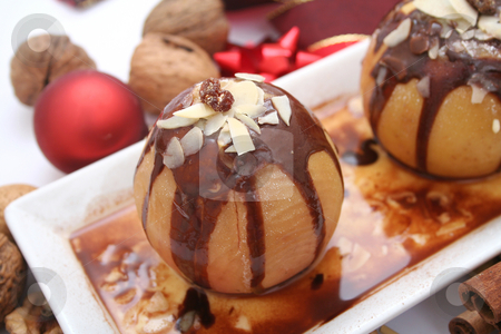 To use this stock image in your creative project, please select the size you need over to the right and click the "Add to Cart" button.
Your downloaded image will come with the Cutcaster watermark removed so don’t worry about the watermark you see on this page. Apple with chocolate stock photo, Apple with chocolate by Yvonne Bogdanski