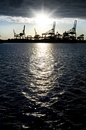 To use this stock image in your creative project, please select the size you need over to the right and click the "Add to Cart" button.
Your downloaded image will come with the Cutcaster watermark removed so don’t worry about the watermark you see on this page. Industrial harbor silhouette stock photo, Silhouette of an industrial harbour against a bright sunset, reflected in the dark, cold water by Corepics VOF