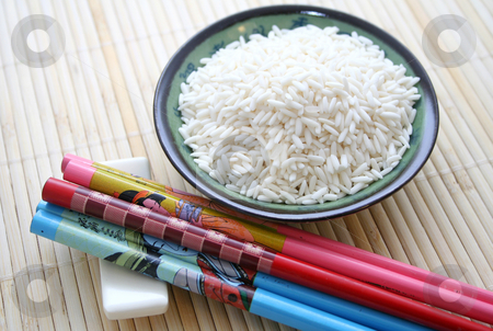 To use this stock image in your creative project, please select the size you need over to the right and click the "Add to Cart" button.
Your downloaded image will come with the Cutcaster watermark removed so don’t worry about the watermark you see on this page. Chopsticks and rice stock photo, Chopsticks and rice by Yvonne Bogdanski