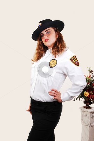 To use this stock image in your creative project, please select the size you need over to the right and click the "Add to Cart" button.
Your downloaded image will come with the Cutcaster watermark removed so don’t worry about the watermark you see on this page. Pretty security guard. stock photo, A lovely security guard from an shopping mall in the US in her good looking
uniform with bright red hair. by Horst Petzold