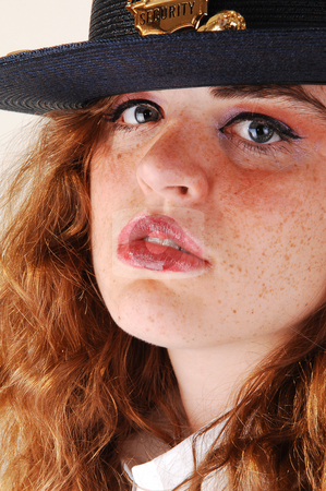 To use this stock image in your creative project, please select the size you need over to the right and click the "Add to Cart" button.
Your downloaded image will come with the Cutcaster watermark removed so don’t worry about the watermark you see on this page. Pretty security guard. stock photo, Close-up shoot of a pretty security guard from a shopping mall in the US
in her uniform with her bright red hair. by Horst Petzold