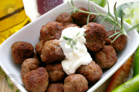 To use this stock image in your creative project, please select the size you need over to the right and click the "Add to Cart" button.
Your downloaded image will come with the Cutcaster watermark removed so don’t worry about the watermark you see on this page. Meatballs stock photo, by Yvonne Bogdanski