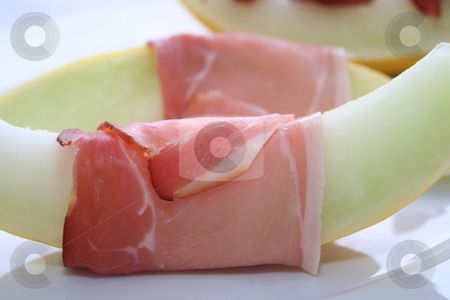 To use this stock image in your creative project, please select the size you need over to the right and click the "Add to Cart" button.
Your downloaded image will come with the Cutcaster watermark removed so don’t worry about the watermark you see on this page. Melone and bacon stock photo, by Yvonne Bogdanski
