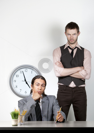 To use this stock image in your creative project, please select the size you need over to the right and click the "Add to Cart" button.
Your downloaded image will come with the Cutcaster watermark removed so don’t worry about the watermark you see on this page. Bored man and angry coworker stock photo, Bored man at work with an angry coworker behind him by Scott Griessel