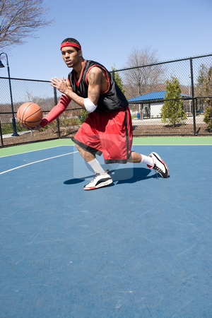 To use this stock image in your creative project, please select the size you need over to the right and click the "Add to Cart" button.
Your downloaded image will come with the Cutcaster watermark removed so don’t worry about the watermark you see on this page. Basketball Player Dribbling stock photo, A young basketball player driving to the hoop demonstrating his ball handling skills. by Todd Arena